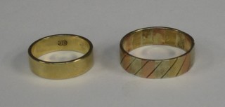A 2 colour gold wedding band and 1 other