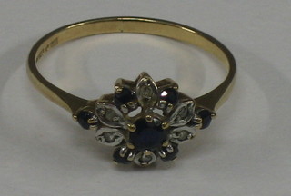 A 9ct gold dress ring set "sapphires and diamonds"
