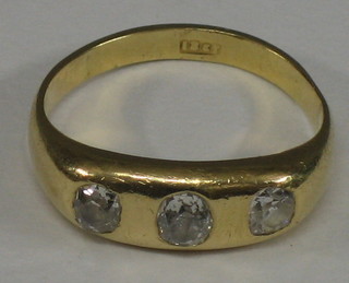 A gentleman's 18ct gold 3 stone gypsy ring set diamonds 