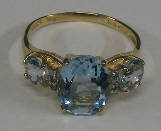 A lady's dress ring set blue stones