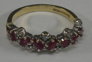 A lady's 9ct gold dress ring set "ruby" and "diamonds"