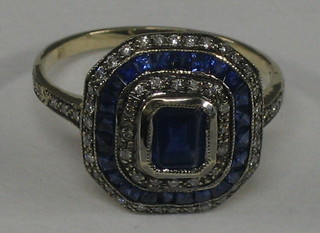A lady's 18ct white gold dress ring set sapphires and diamonds