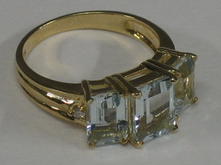 A lady's "gold" dress ring set 3 "aquamarines"
