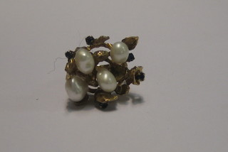 An Eastern 14ct gold dress ring set pearls and sapphires