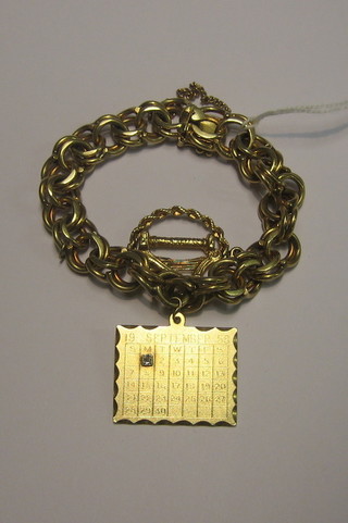 A 14ct gold multiple chain charm bracelet hung a 14ct gold September calendar pendant and a 14ct gold harp pendant, 2 ozs