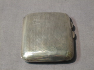 A silver cigarette case with engine turned decoration and Jubilee hallmark, Birmingham 1935