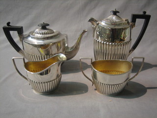A harlequin silver plated 3 piece tea service of oval form with demi-reeded decoration comprising teapot, cream jug and twin handled sugar bowl