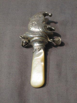A child's silver rattle in the form of Mr Punch with mother of pearl teething bar, Birmingham 1922