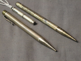 A silver cased tooth pick and 2 silver cased propelling pencils