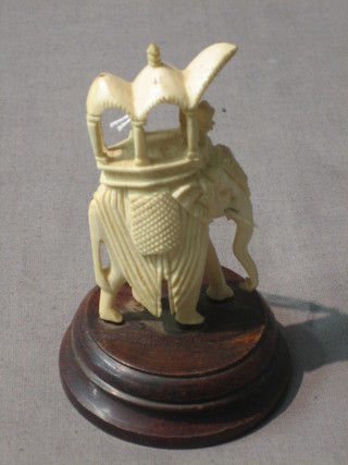 A carved ivory figure of a elephant 3"
