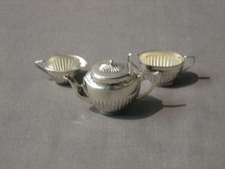 A modern silver miniature 3 piece tea service with teapot, sugar bowl and cream jug, base marked 925