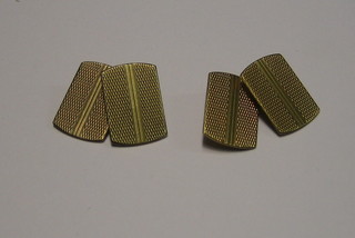 A pair of gentleman's 9ct gold cufflinks with engine turned decoration