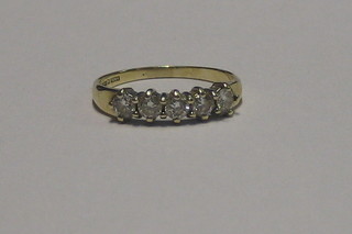 A lady's 9ct gold dress ring set 5 white stones
