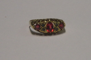 An 18ct gold dress ring set red and white stones