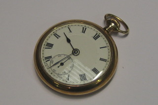 An open faced pocket watch contained in a 9ct gold case