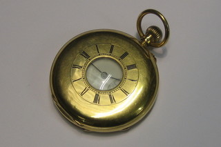 A gentleman's half hunter pocket watch contained in a 9ct gold case by G Ashton Ilford London