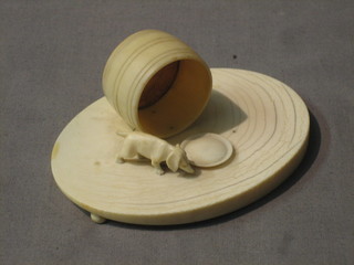 An ivory figure group in the form of a walking dog with turned barrel and plate 4"