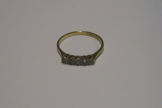 A lady's gold dress ring set 5 illusion cut diamonds