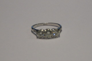 A lady's 18ct white gold engagement/dress ring set 3 large diamonds and 6 diamonds to the shoulders (approx 1.05ct)