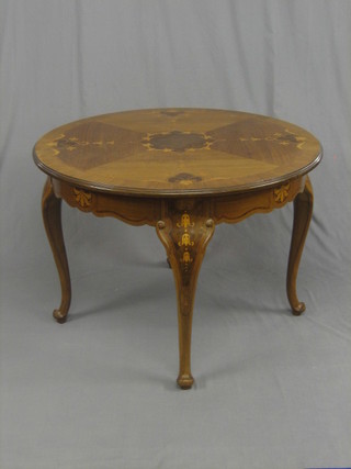 A 20th Century circular French inlaid mahogany occasional table raised on cabriole supports 39"