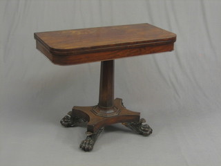 A William IV mahogany D shaped tea table, raised on a chamfered column with triform base and paw feet, 36"