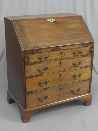 A Georgian mahogany bureau with fall front revealing a well fitted interior above 4 long graduated drawers, raised on bracket feet 33"