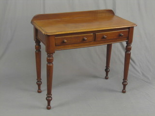 A Victorian mahogany side table with raised back, fitted 2 frieze drawers and raised on turned supports 36"
