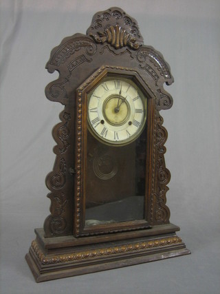 An American 8 day striking shelf clock, contained in a carved pine case