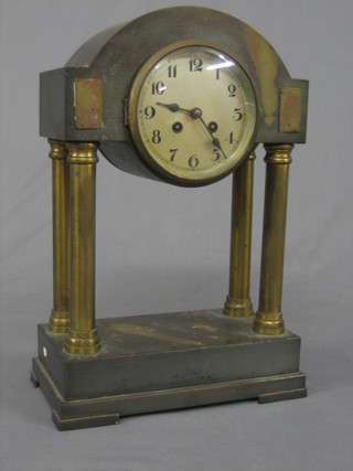 An Art Deco striking "Portico" clock, the silvered dial with Arabic numerals supported by 4 gongs