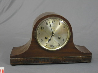 An  8 day striking mantel clock with silvered dial and Arabic numerals contained in a mahogany Admiral's hat shaped case by Ingasol