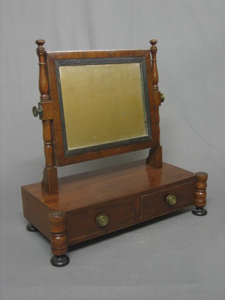 A 19th Century rectangular plate dressing table mirror contained in a mahogany swing frame, the base fitted 2 drawers, raised on turned supports 17"