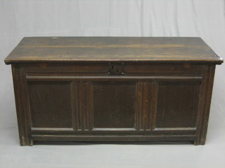 An 18th Century oak coffer of panelled construction with hinged lid (back panel holed) 58"