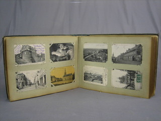 A green album of various French black and white postcards