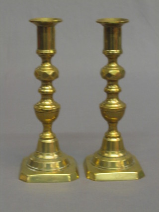 A pair of 19th Century brass candlesticks with ejectors 8" 