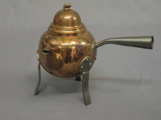A curious Art Nouveau style copper and hammered steel side handled kettle