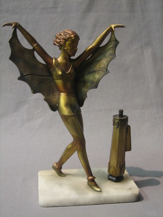 An Art Deco painted spelter table lighter in the form of a standing naked lady, raised on a marble base 