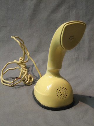 A 1970's cream Ericofon telephone, (dial jammed)