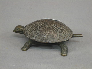 A bronze paper clip in the form of a tortoise 4"