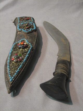 A Kukri contained in a jewellery leather scabbard