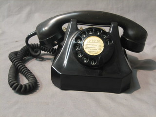 A Swiss black Bakelite dial telephone