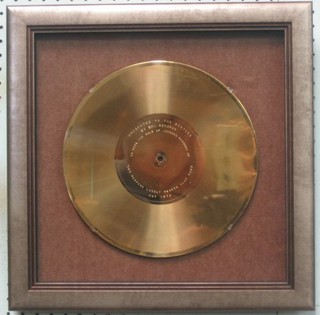 An EMI Gold record disc, engraved "Presented to the Beatles by EMI to mark the sale of the 1,000,000 records of Sergeant Pepper's Lonely Hearts Club Band May 1970"
