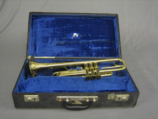 A Corton brass trumpet, cased