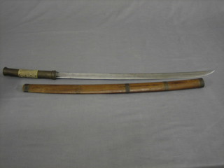 An Eastern sword with 24" curved blade and shagreen grip contained in a wooden scabbard