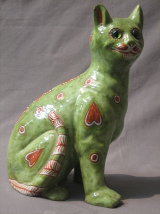 A Galle style green glazed and floral patterned pottery figure of a seated cat, the base marked Masanic 15 (ear chipped) 12"