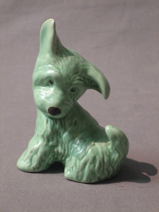 A Sylvac green glazed figure of a seated dog, the base marked Sylvac England 4"