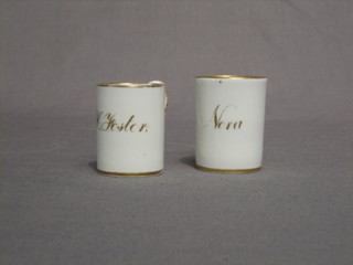 A pair of 19th Century miniature porcelain mugs with gilt banding marked Nora and H Foster   2" high