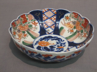 A 19th Century Japanese Imari porcelain bowl with panelled body and wavy border 7 1/2" (chip to rim)