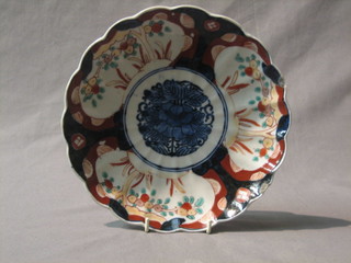 A circular Japanese Imari porcelain plate with floral decoration and lobed rim 9 1/2"