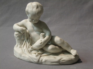 A 19th Century Parian figure of a reclining child with dove 8"