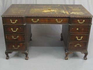 A Chippendale style inverted breakfront kneehole pedestal desk with brown leather inset tooled writing surface, fitted 9 long drawers and raised on cabriole ball and claw supports 54"